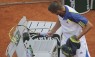 The wrong kind of smash... Russian player Youzhny takes out his anger on his racquet